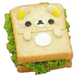 a sandwich with lettuce poking out and a bear face